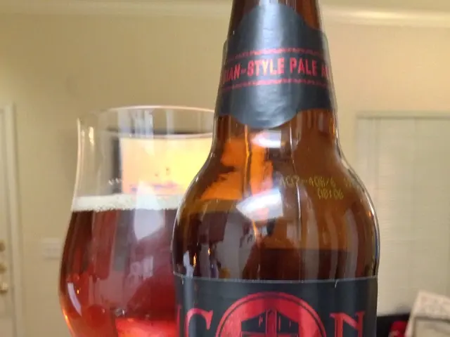 In the image we can see there is a wine bottle and a wine glass and a atm card.