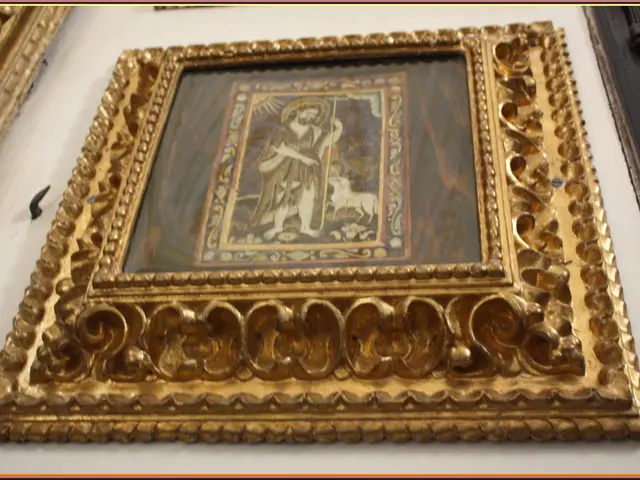 Here in this picture there is a gold frame hanging on the wall.