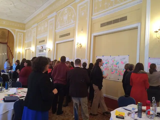 In the image there are many people looking at the posters and charts on the wall,this seems to be a...