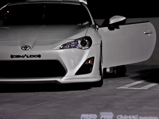 In the image there is a car and the door of the car is opened, there is some text on the bottom...