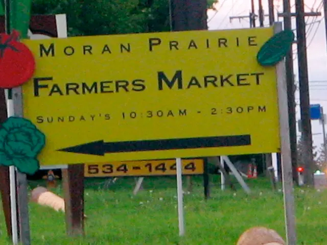 In this image I can see the yellow color board and the farmers market is written on it. To the side...