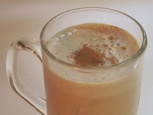 In this picture we can see a mug with liquid on a platform.