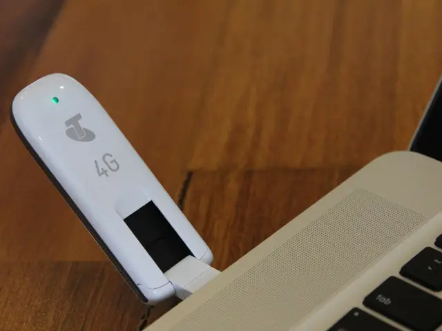 In the picture there is a data card connected to a laptop.