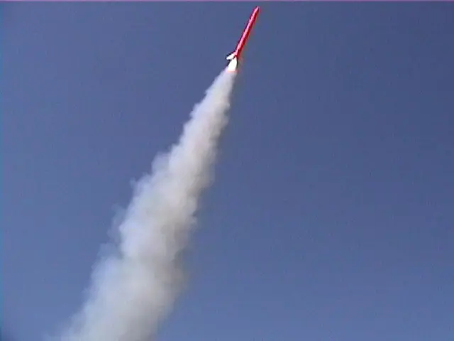 In this picture there is a rocket in the sky. At the bottom there is smoke. At the top there is...