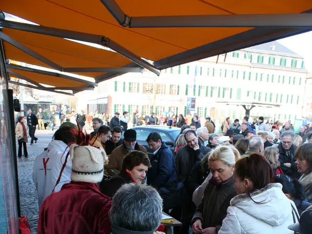 In this image in the center there are persons and there is a car which is black in colour. In the...