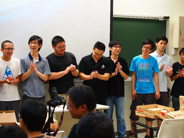 In this picture, we can see a group of people some are standing on the floor and some people are...