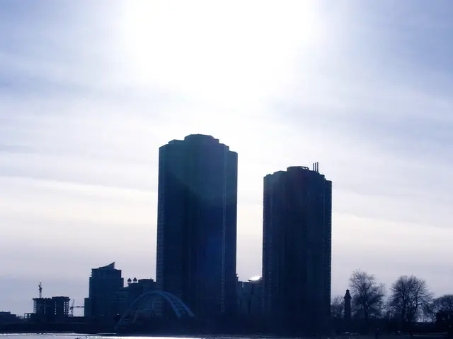 In this image we can see building, grill, water, swan, trees and sky with clouds.